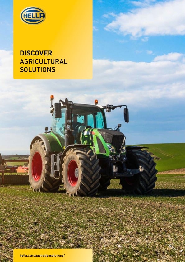 A green Fendt tractor in a field featured on a Hella Agricultural Solutions brochure cover.