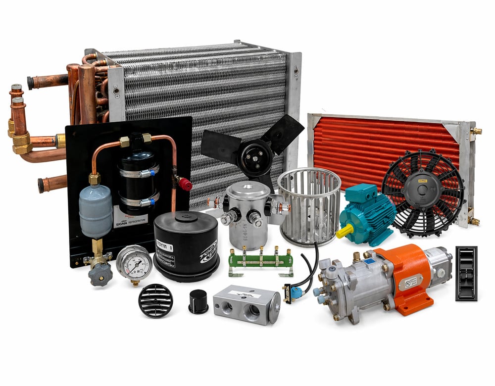A collection of industrial refrigeration and HVAC spare parts, including heat exchangers, electric motors, fans, gauges, and compressors.